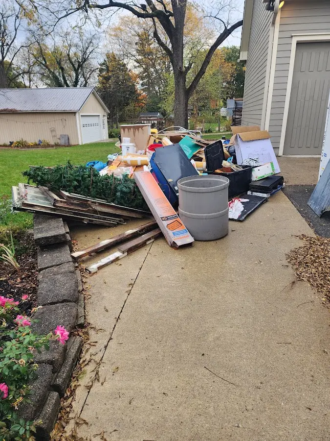 Dumpster being loaded with debris for Roofing Dumpster Rental in Lucerne